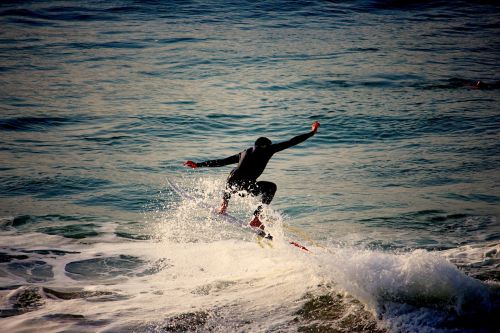 surfing surfer water