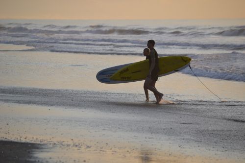 surfing sunset surfers