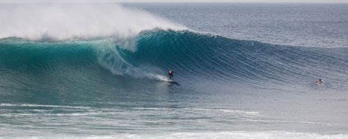 surfing big waves ombak tuju coast