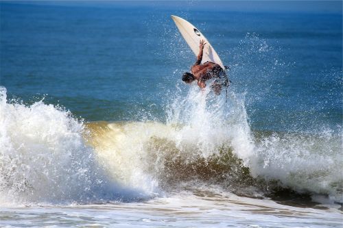 surfing surfer surfboard