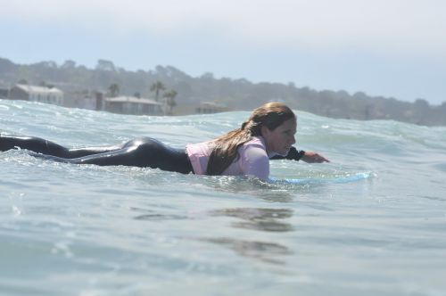 surfing paddling surfer girl