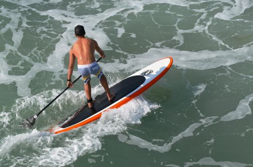 surfing paddle board ocean