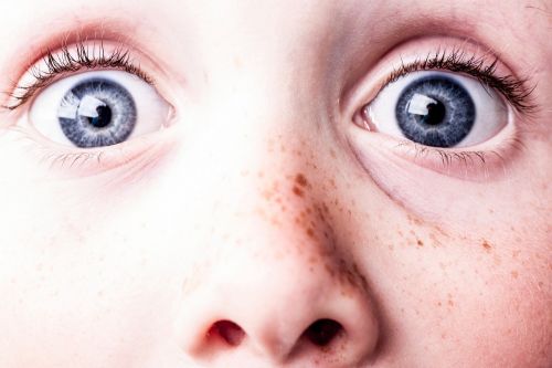 surprised blue eyes freckles