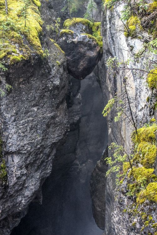 suspended rock boulder