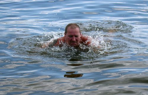 swimmer floats river