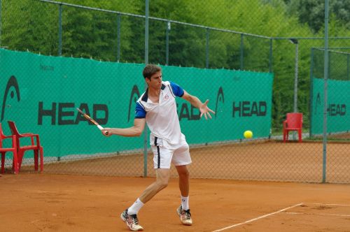 tennis player clay court ball