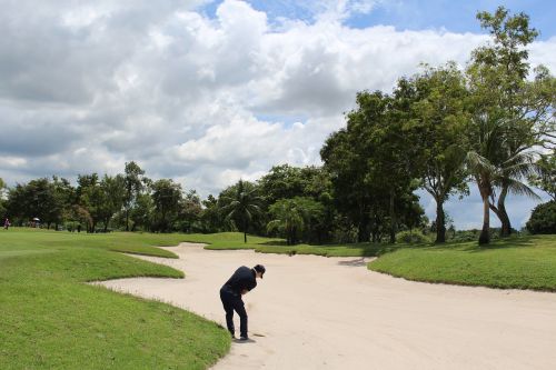 thailand golf golfer sand trap