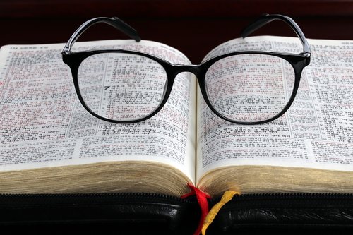the bible  glasses  book