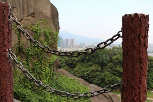 the chains railing stone pillars