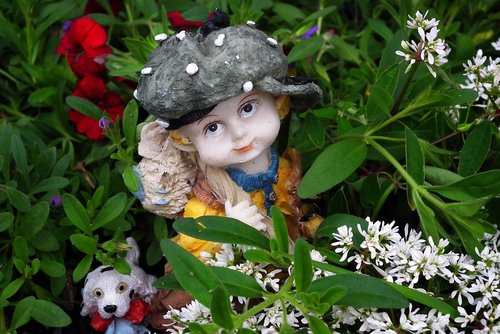 the figurine  garden  flowers