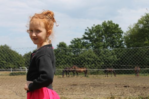 the little girl horses a smile