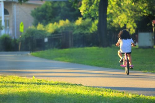 the little girl bike sunset