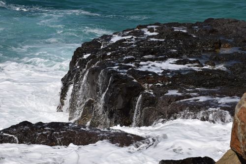 the waves beach the stones