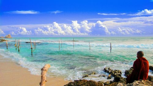 theravada buddhism monk beside beach seaside