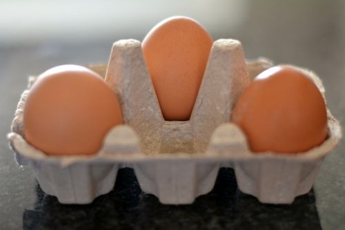 three eggs container food