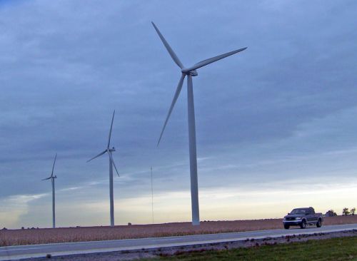 Three Windmills And A Truck