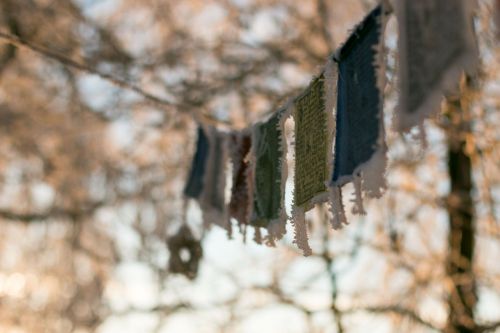 tibetan prayer flags winter frozen