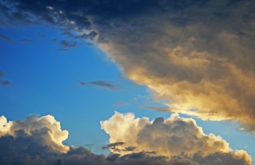 Tinted Clouds In Blue Sky