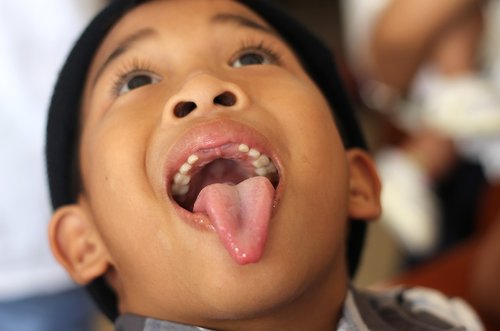 tongue  teeth  boy