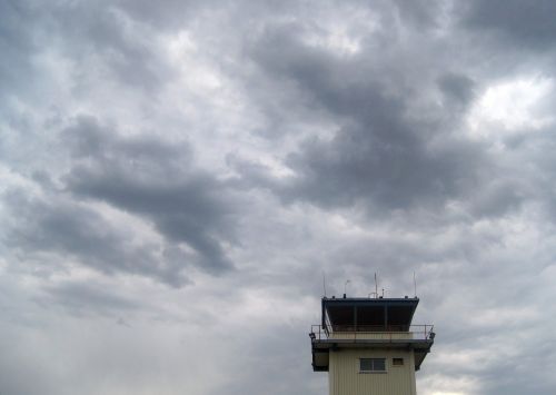 Top Of Control Tower And Dark Cloud