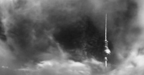 tower clouds sky black and white