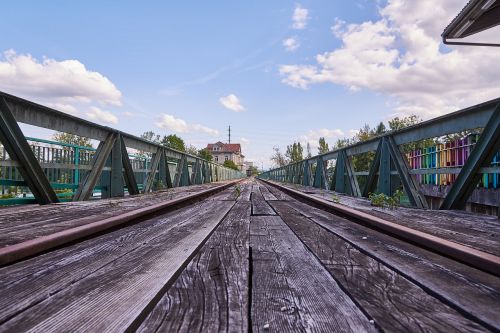 tracks clouds bridge