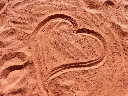 tracks in the sand heart shape love
