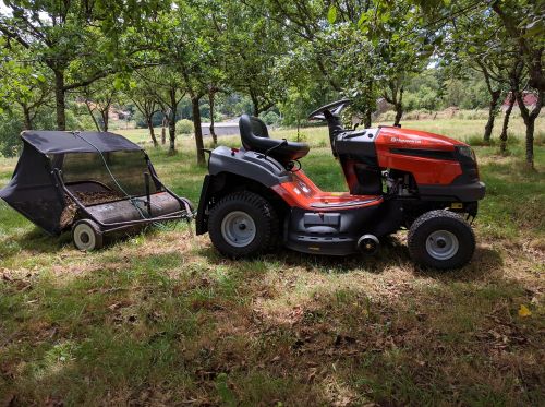 tractor sweeper leaves apple trees