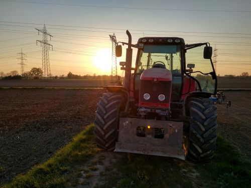 tractor sunset agriculture