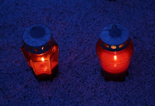 two red candles  lantern  illumination
