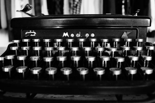 typewriter typing black and white
