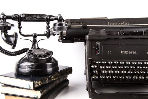Typewriter With Book And Phone