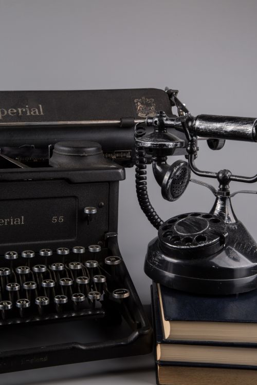 Typewriter With Books And Phone