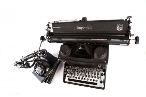Typewriter With Books And Phone