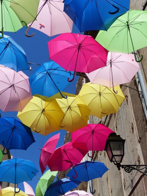 umbrellas colorful blue sky
