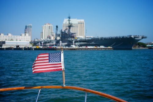US Flag And Navy Ship