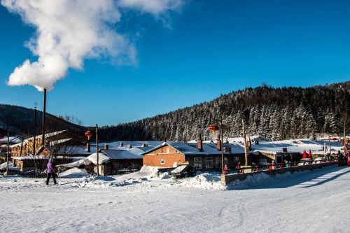 village snow blue sky