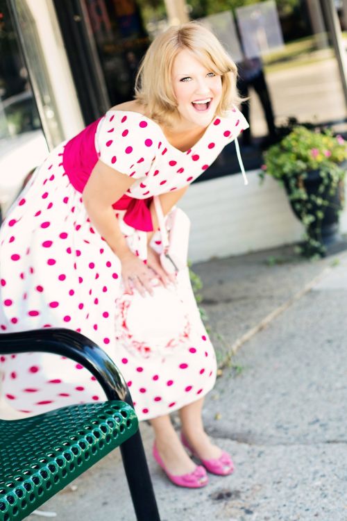 vintage woman polka dot dress laughing