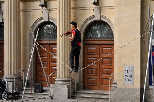 violinist tightrope walker clown