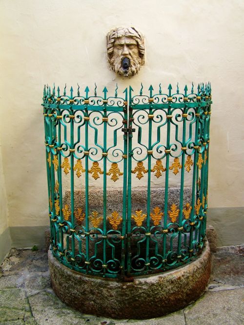 wall fountain wrought iron decorative fence ancient