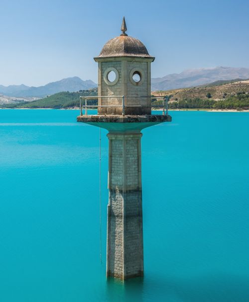 watchtower lake turquoise water