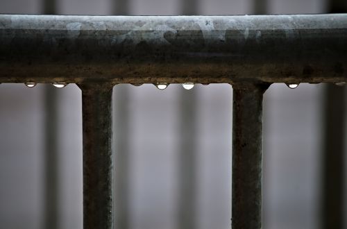 water droplets railing metal