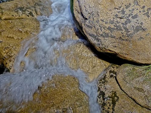 Water Flowing From Boulders