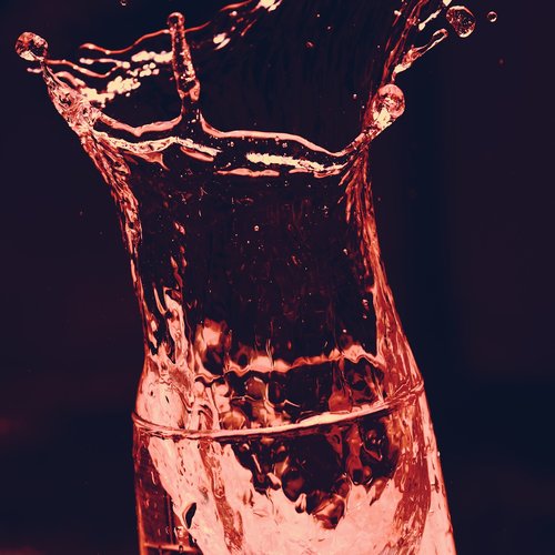 water glass  red  dissolved