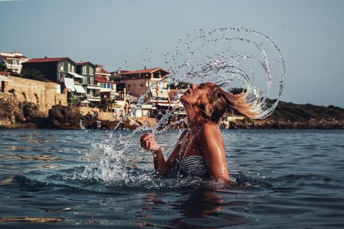 water splash with hair beautiful girl seaside portrait