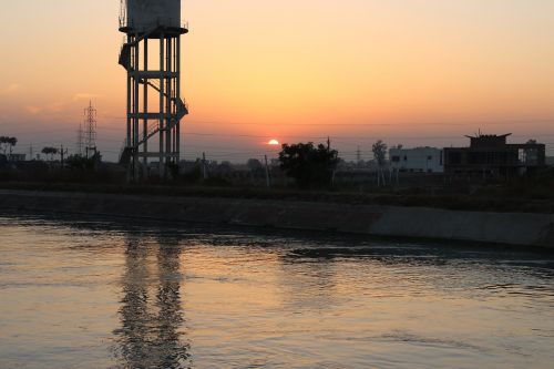 water tank sunset river