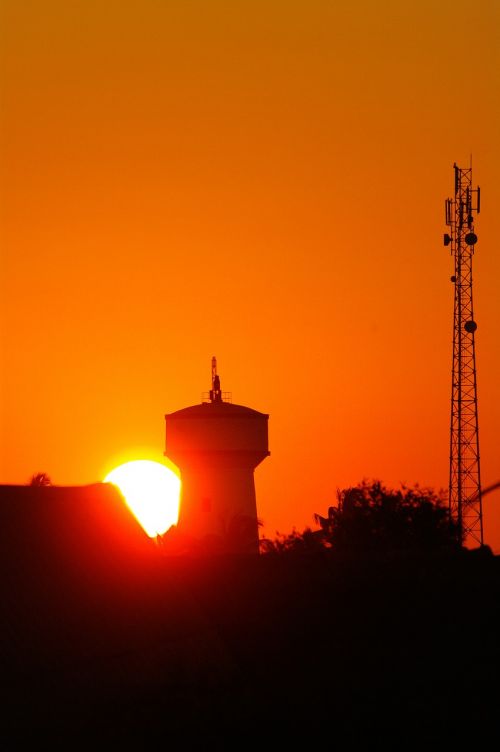 water tower radio tower sunset
