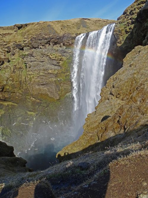 waterfall mountain rainbow