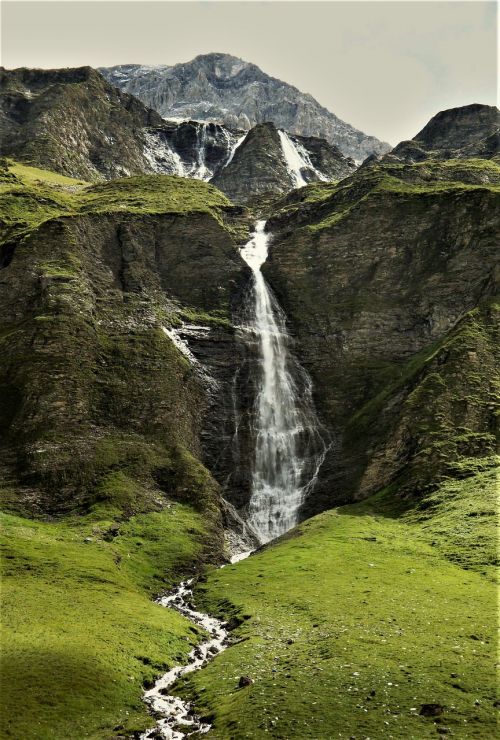 waterfall glacial lake mountains