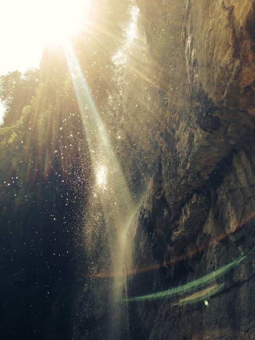 waterfall backlit rock